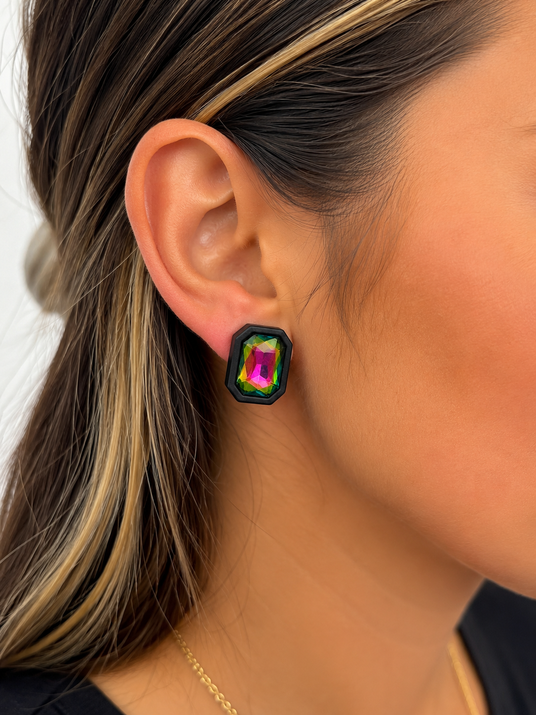 Midnight Prism statement stud earring shown on ear with multicolor faceted stone