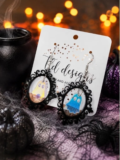 Colorful haunted ghost portrait dangle earrings in black oval frames