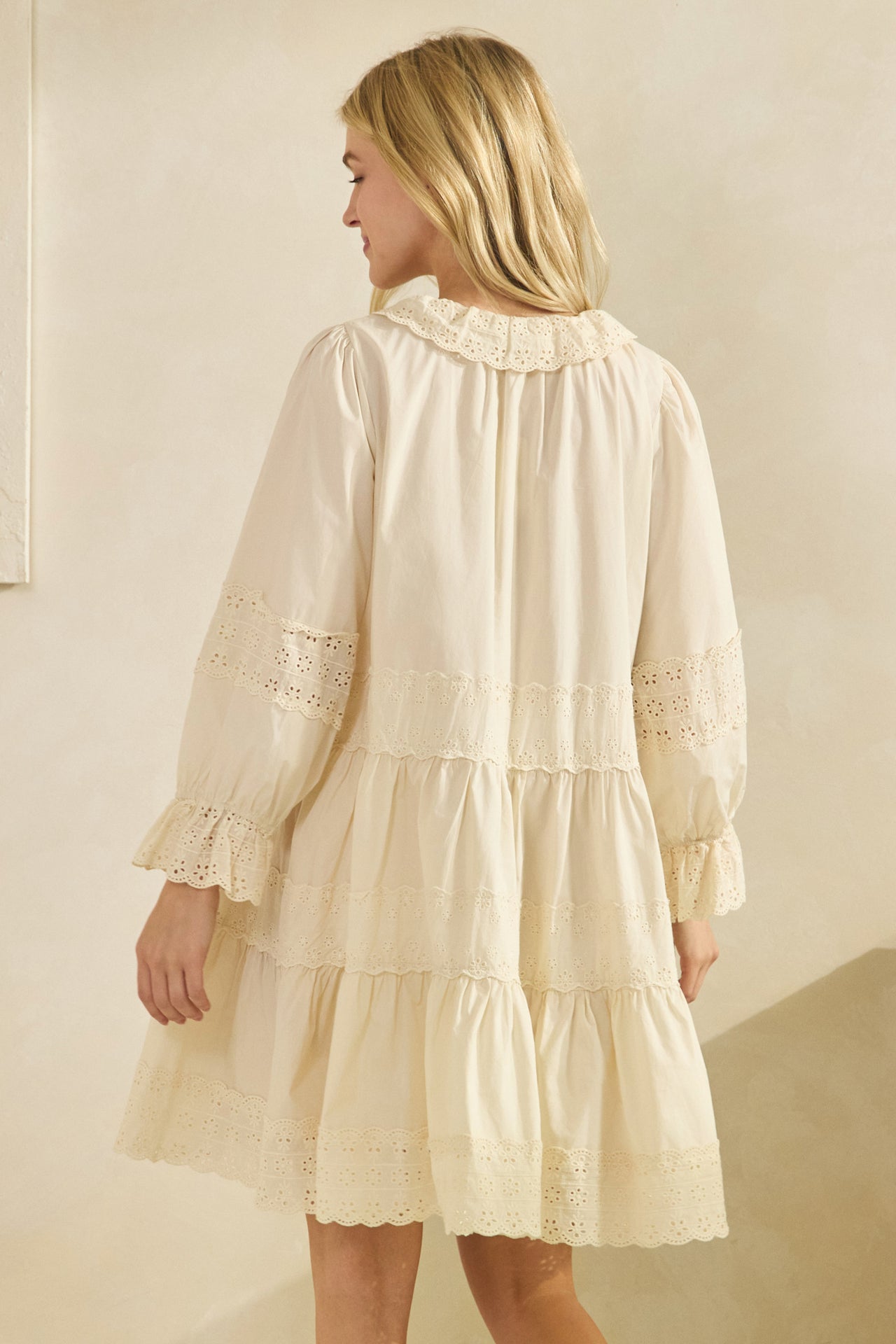 cream flowy dress movement showing lightweight cotton fabric