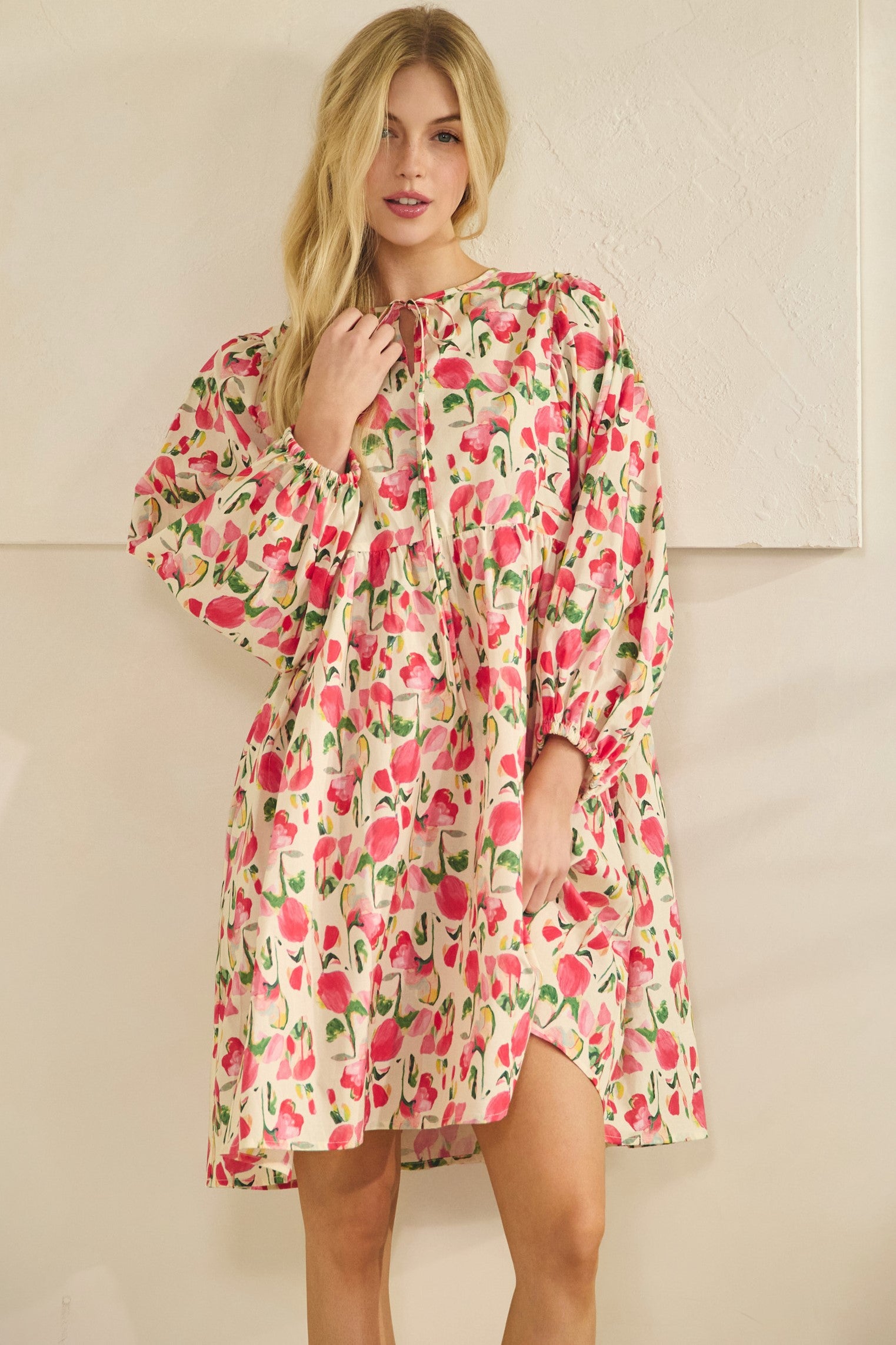watercolor print dress showing flowy silhouette and gathered waist