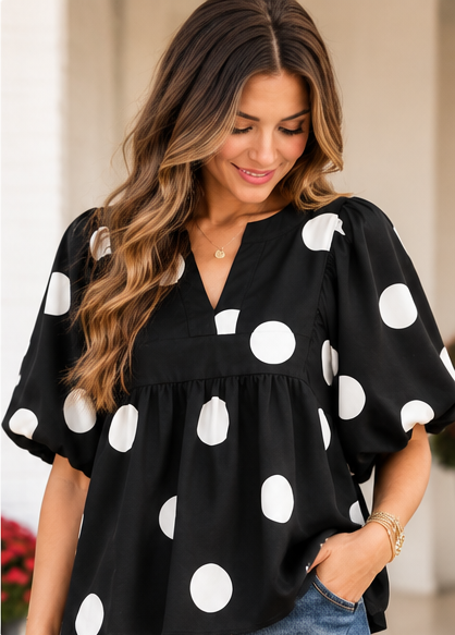 A woman modeling a black blouse with large white polka dots and wide short sleeves, paired with blue jeans, shown in a collage of multiple views including front, back, and close-ups.