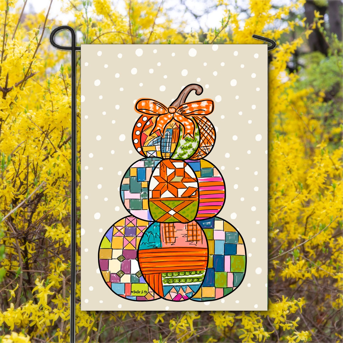 Decorative garden flag with colorful patchwork design on a yellow background