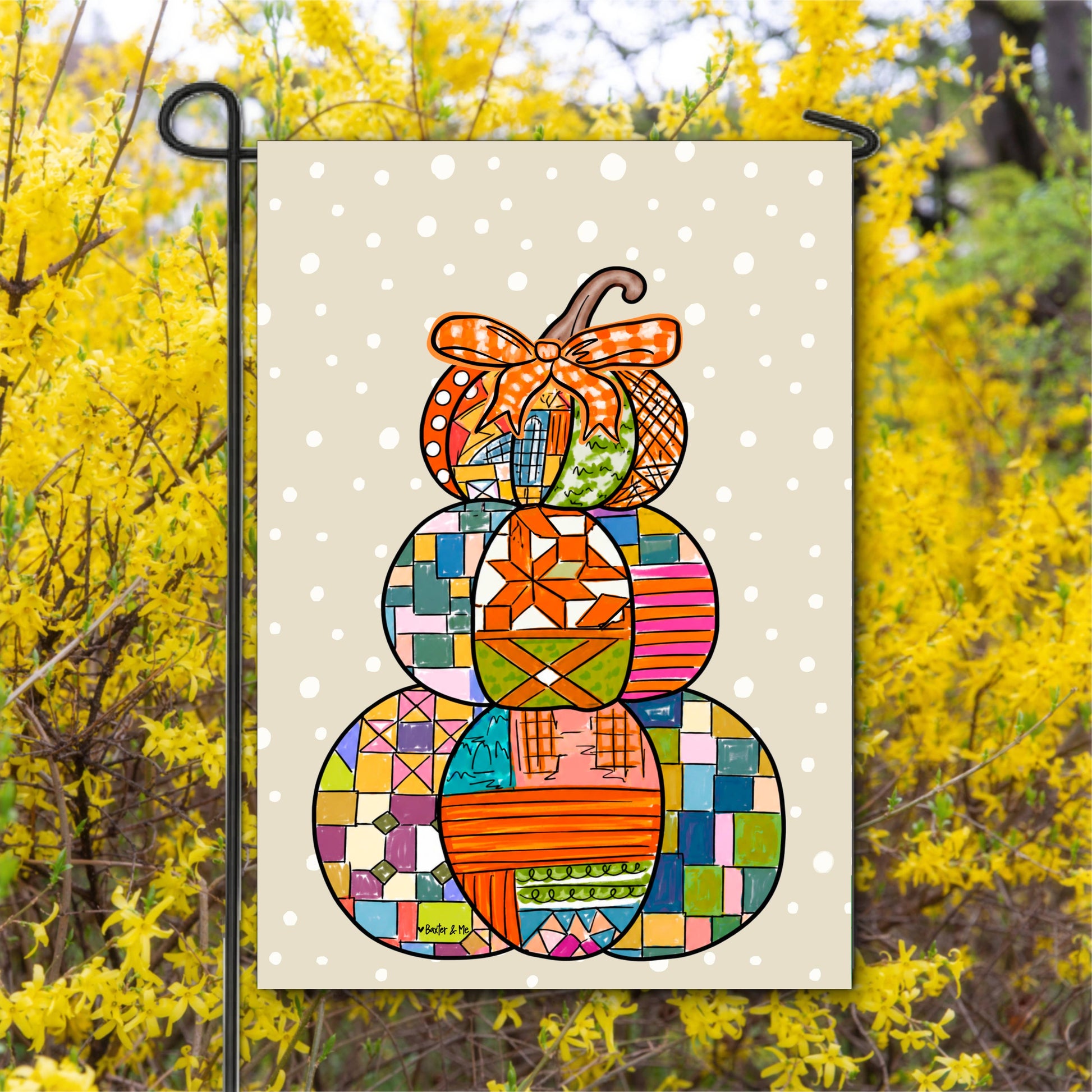 Decorative garden flag with colorful patchwork design on a yellow background