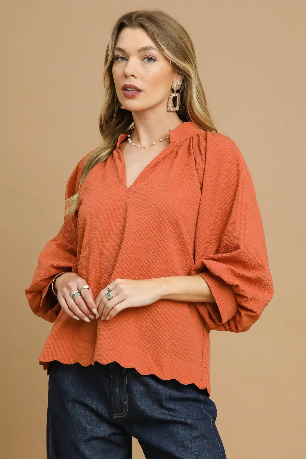 rust textured v neck blouse with balloon sleeves and scallop hem women’s top front view