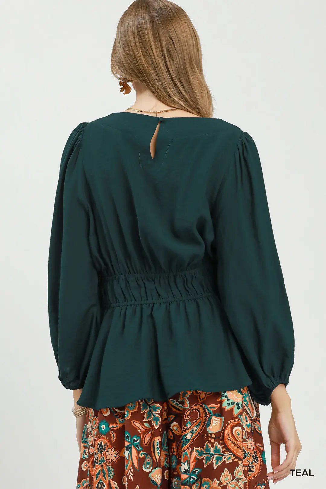 Umgee teal smocked waist peplum blouse, close-up neckline detail