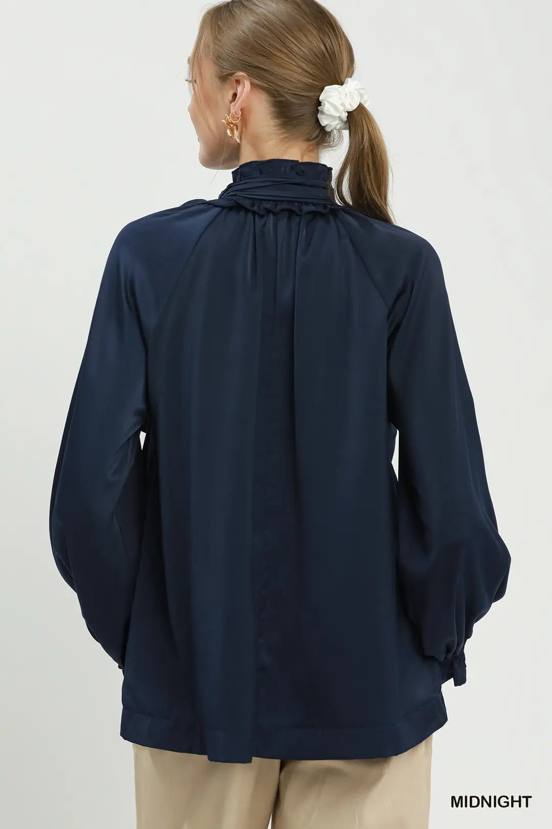Umgee satin tie-neck ruffle blouse in midnight navy, back view