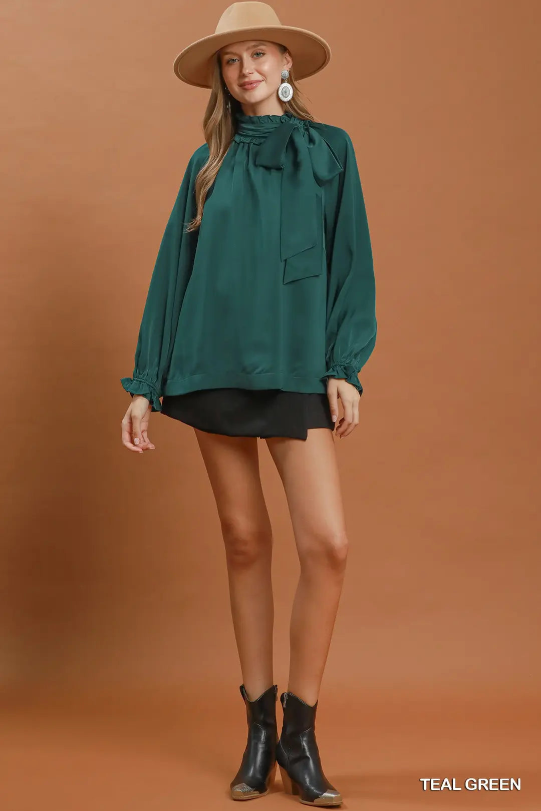 Umgee satin tie-neck ruffle blouse in teal green, close-up bow detail
