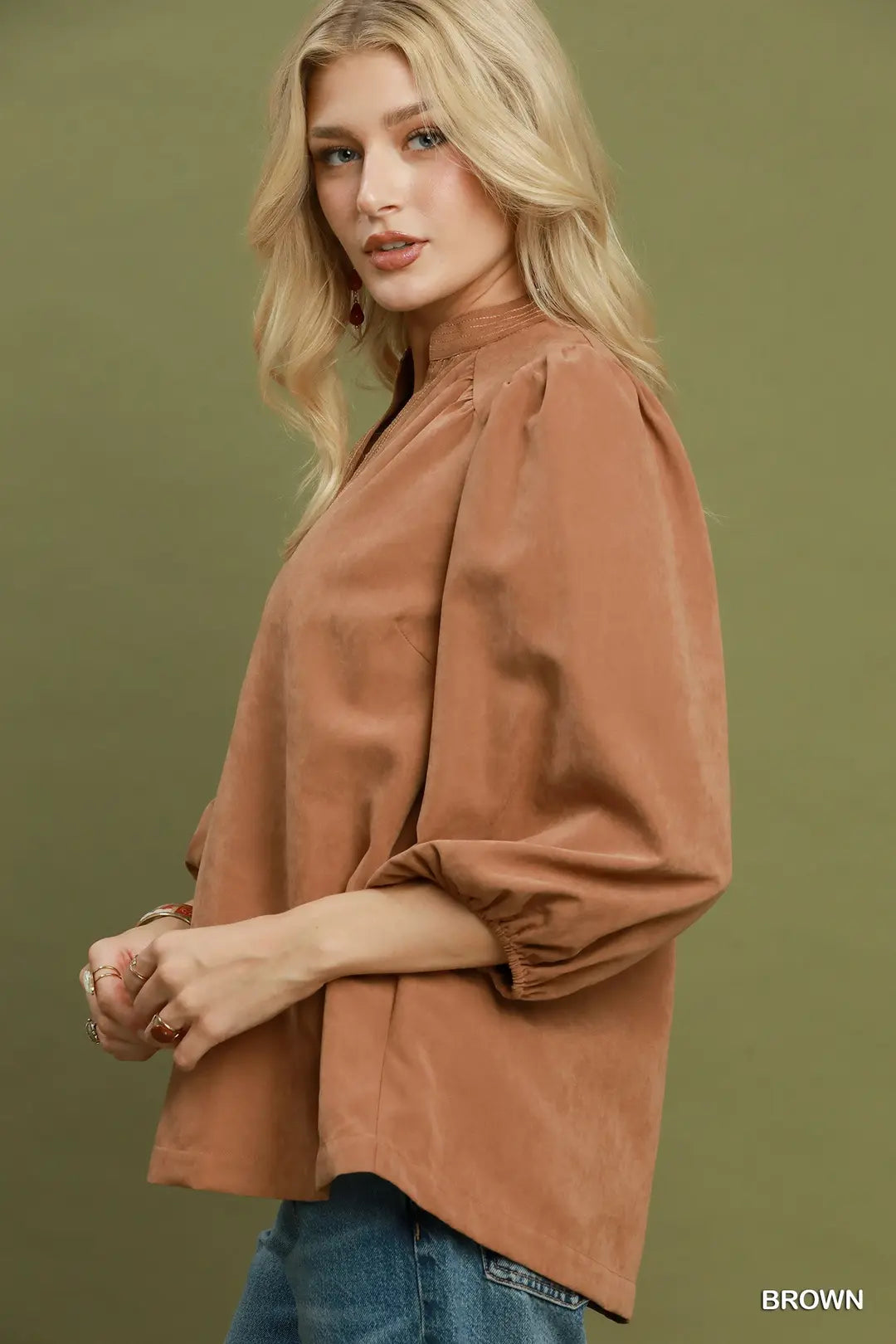 Umgee brown sueded split neck blouse, side view showing high-low hem