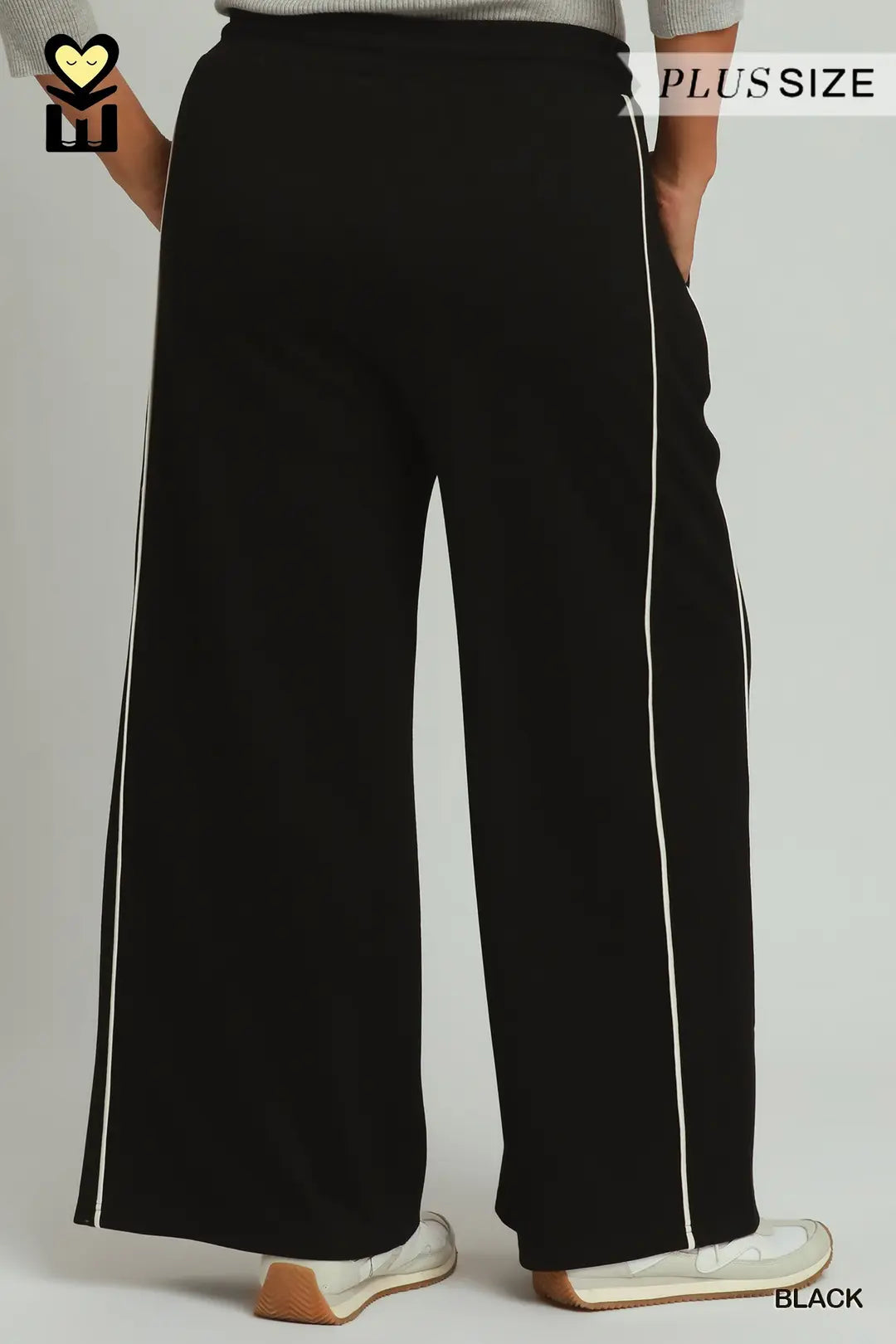Black wide-leg sweatpants with white side stripes, shown on a model from the back. The image includes a 'PLUSSIZE' label in the top right and a 'BLACK' color label in the bottom right.