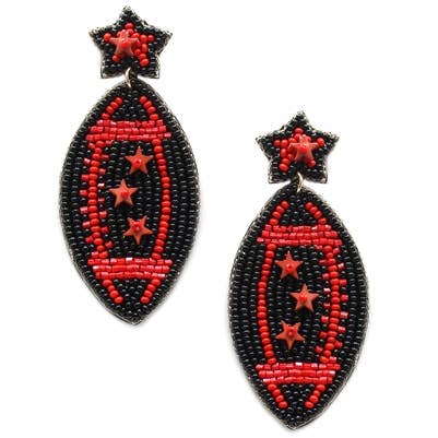A pair of beaded drop earrings featuring a black and red beaded football design with three red stars, hanging from a small black beaded star stud.