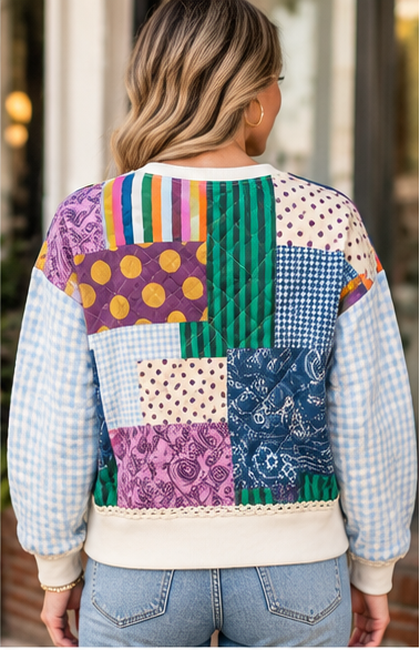 the back of a patchwork poppy & pine sweatshirt