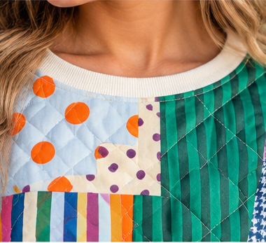 a close up of a patchwork poppy & pine sweatshirt