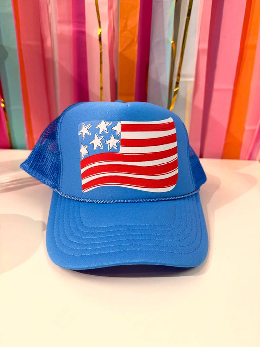 Blue cap with American flag design on a colorful curtain background