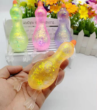 Colorful glitter duck squishy sensory stress toy available in pink purple blue and green glitter colors