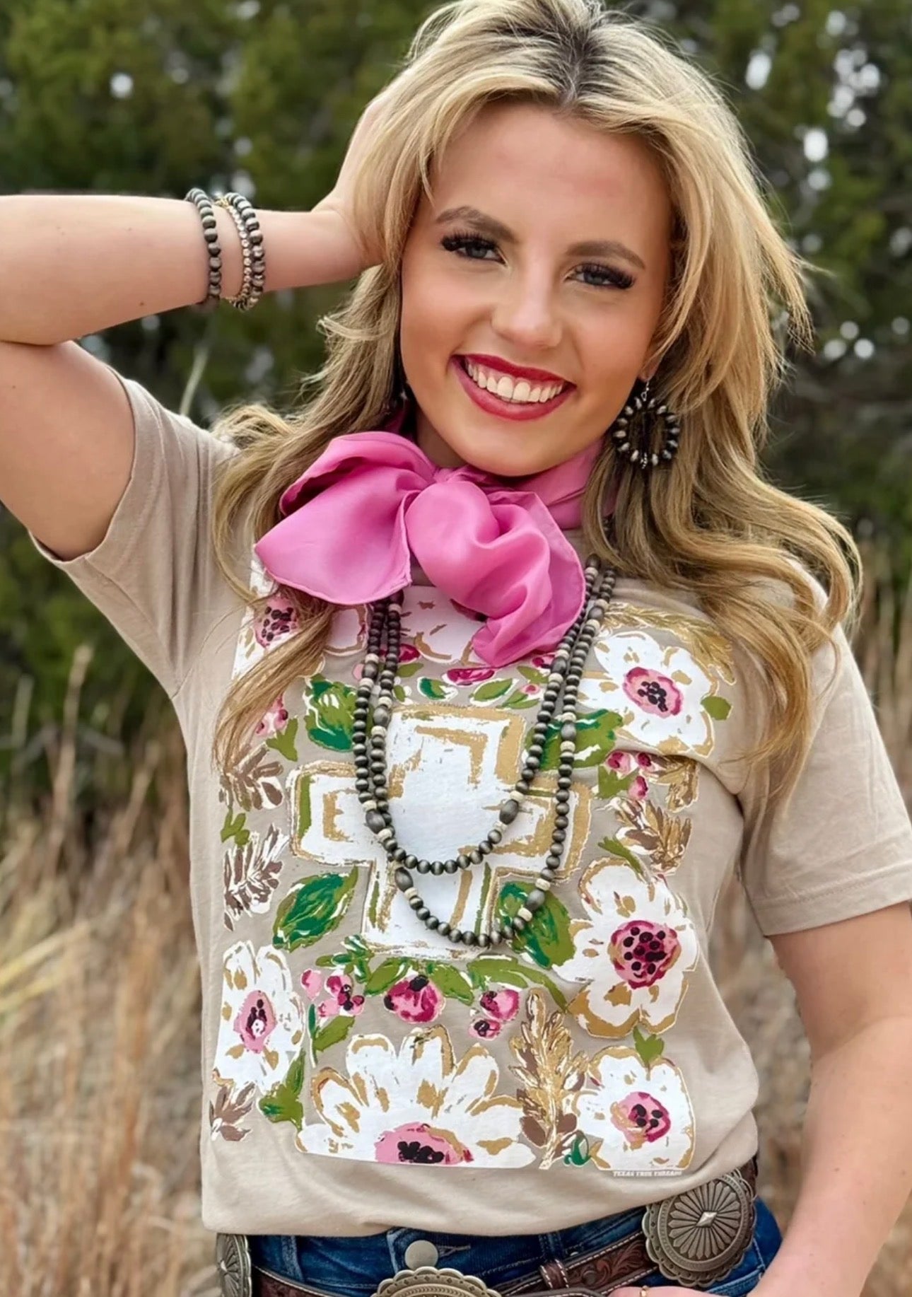 Callie Ann Gold Floral Cross Tee on model - hand-illustrated cross design on Bella Canvas heather tan tee