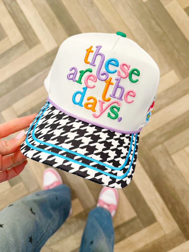 Women's These Are the Days summer trucker hat with colorful embroidered design, houndstooth brim, breathable mesh back, and adjustable snapback.