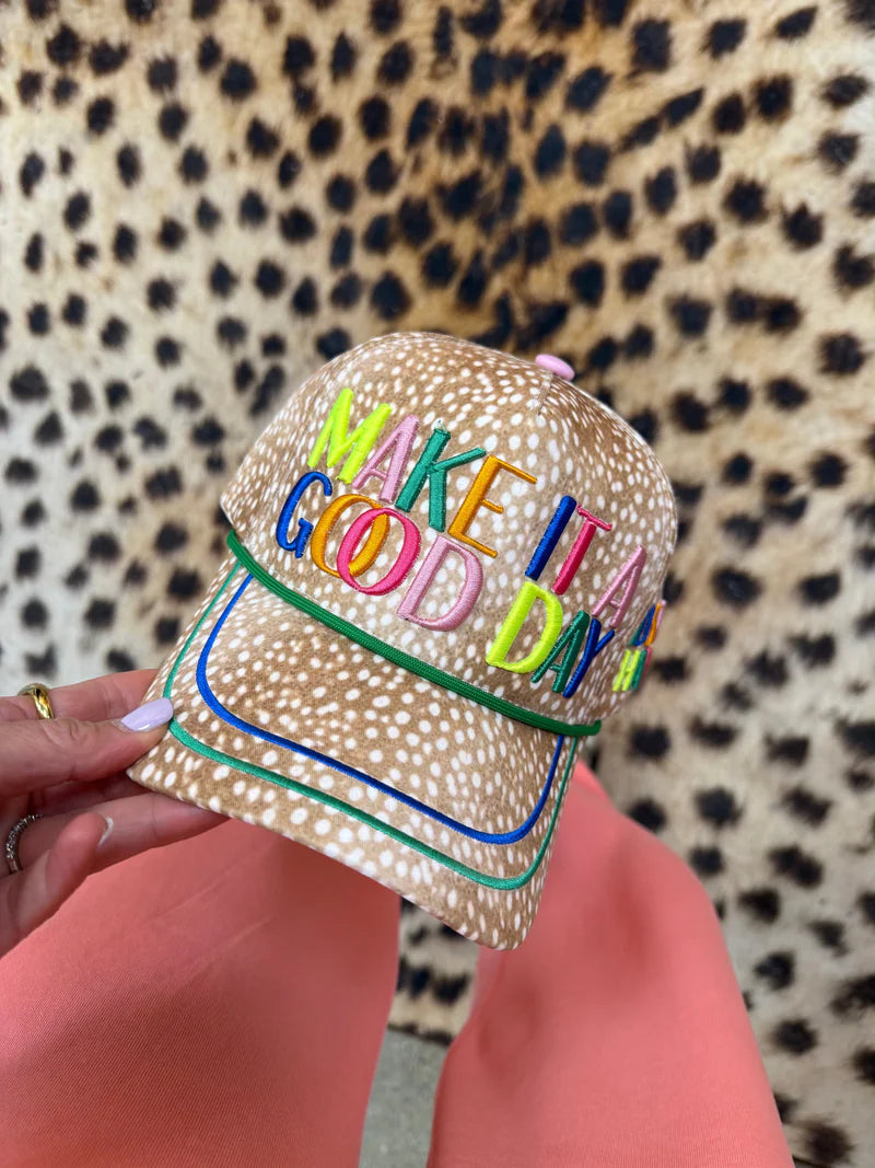Women's Make It a Good Day leopard trucker hat with colorful embroidered lettering, mesh back, and adjustable snapback.