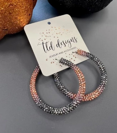Oversized orange and black rhinestone hoop earrings for Halloween