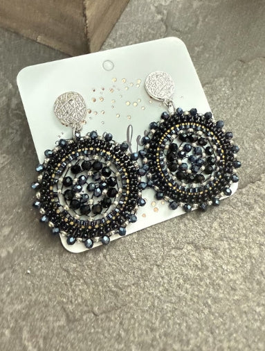 Black beaded medallion statement earrings with shimmering accents