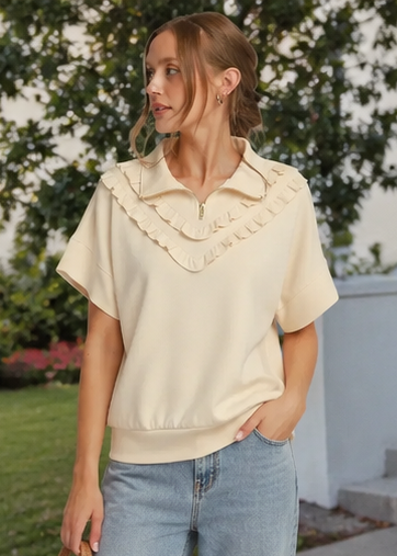 Woman wearing a cream-colored outfit in various outdoor settings.