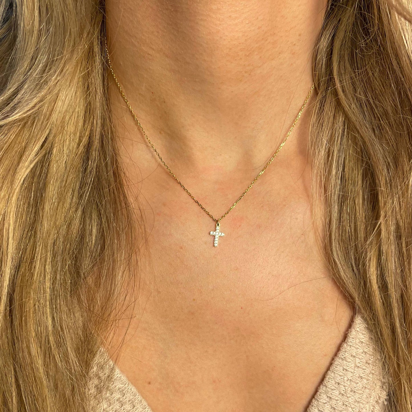 gold dainty waterproof necklace on a model