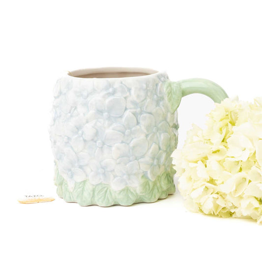hydrangea ceramic coffee mug with textured blue floral design