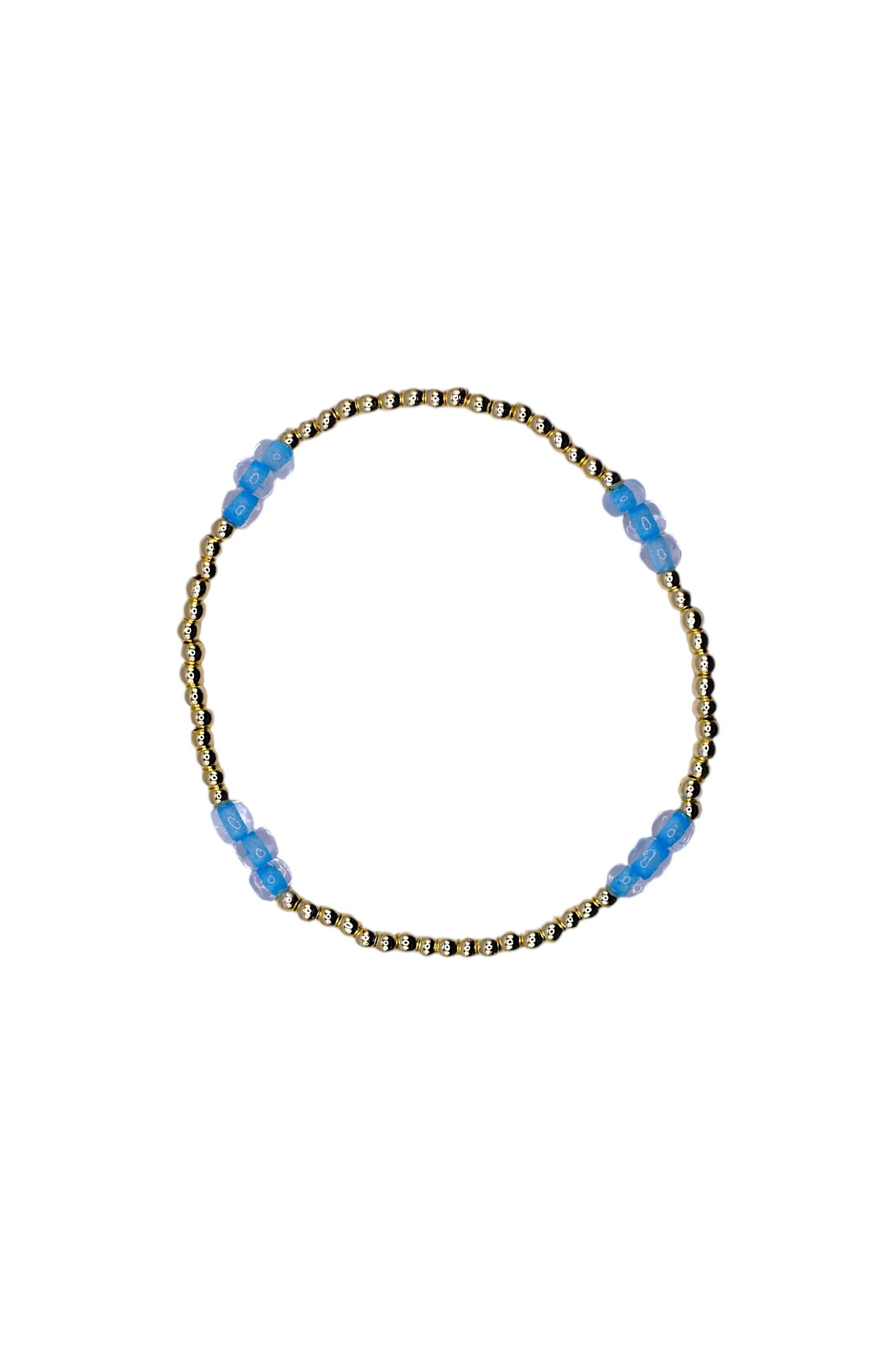 A delicate beaded bracelet with a gold-toned twisted wire base and small translucent light blue beads spaced along the top, shown on a plain white background.