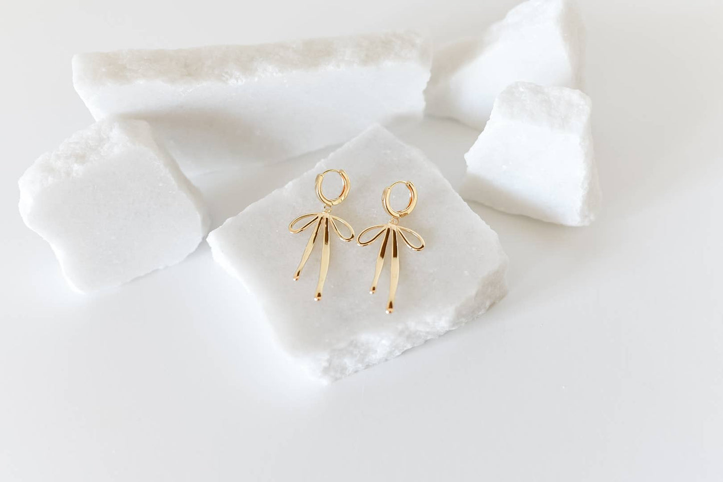 The Daisy gold plated bow hoop earrings