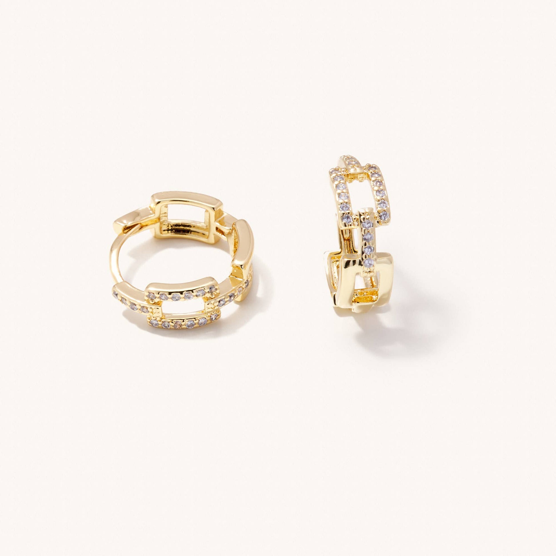 Gold hoop earrings on a white background