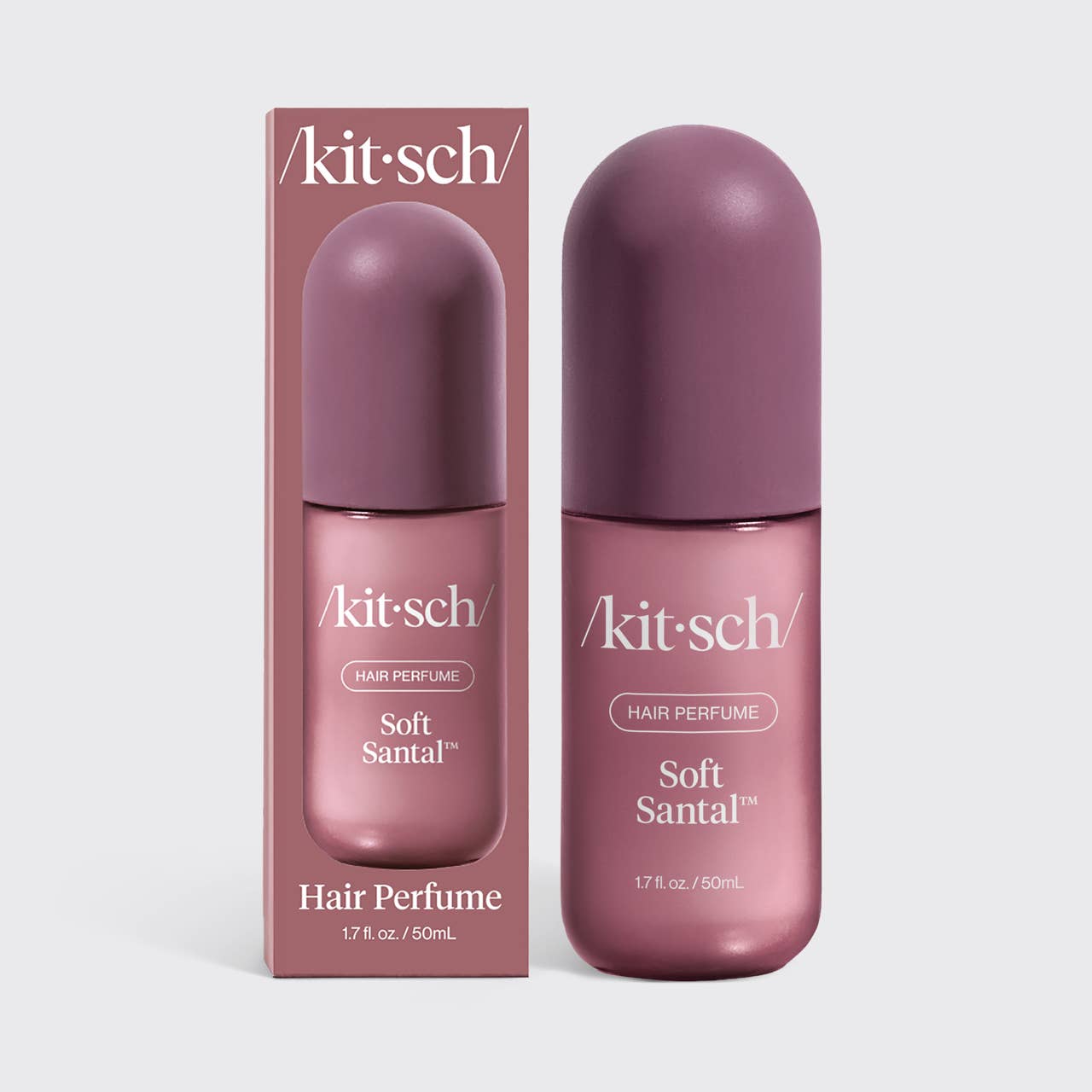 Kit Sch Soft Santal hair perfume bottle and its matching retail box, both in a dusty mauve-purple color, set against a light gray background.