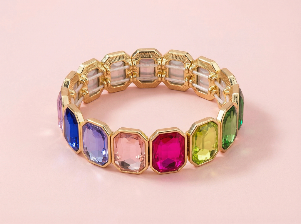 Multicolored gemstone bracelet on a pink background
