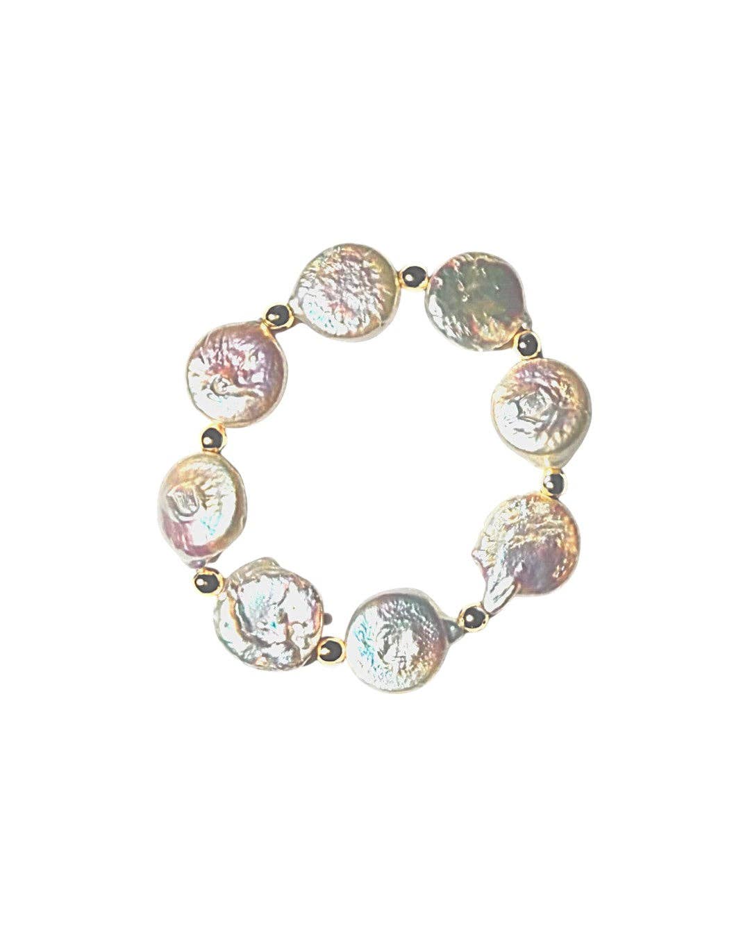 A beaded stretch bracelet featuring irregular, iridescent baroque pearls in pink, green, and white tones, separated by small gold spacer beads, shown on a plain white background.