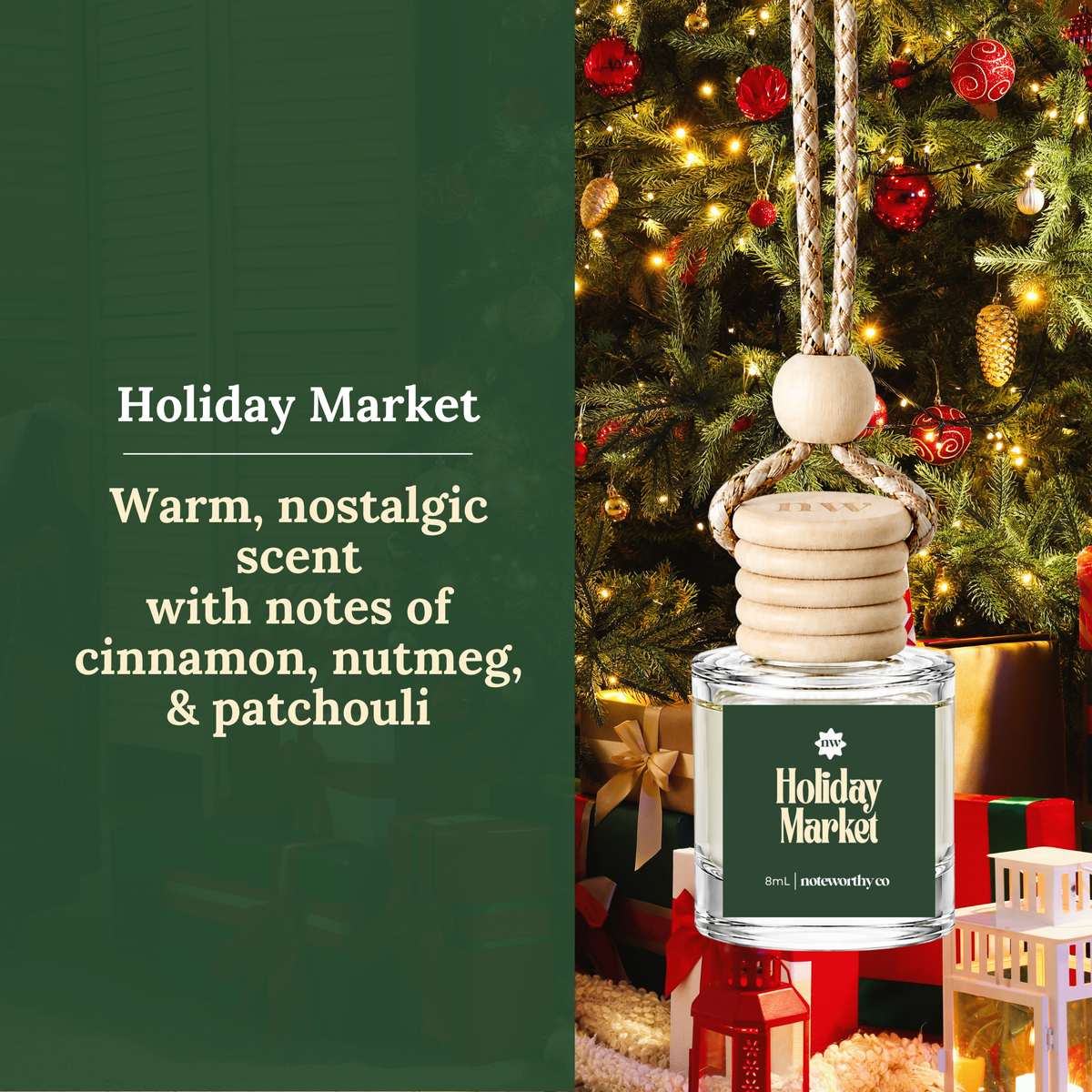 Holiday Market reed diffuser bottle with a hanging wooden reed and chain, shown beside a Christmas tree and wrapped gifts. Text on the left reads: 'Holiday Market Warm, nostalgic scent with notes of cinnamon, nutmeg, & patchouli'.