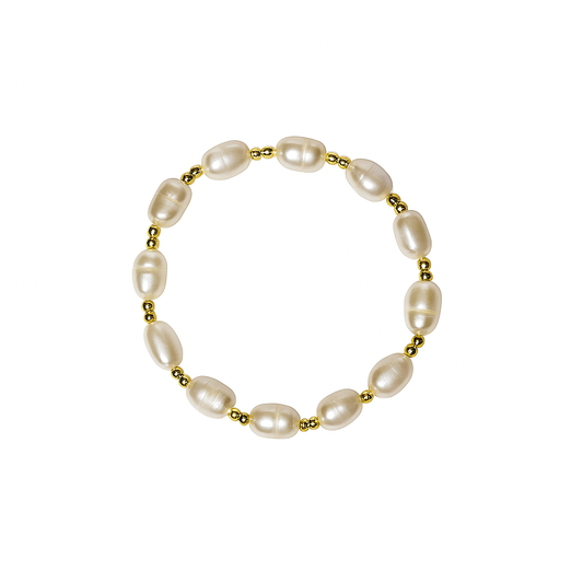 A stretch bracelet featuring irregular white baroque pearls separated by small gold spacer beads, displayed on a clean white background.
